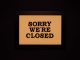 BREAKING: Nike Store in Hoboken Permanently Closes Black-framed 'Sorry We're Closed' sign against a dark backdrop, ideal for business themes.