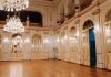 BREAKING: White Eagle Hall to Change Management, Stay Open Elegant concert hall with chandeliers and ornate decor in Maribor, Slovenia.