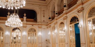BREAKING: White Eagle Hall to Change Management, Stay Open Elegant concert hall with chandeliers and ornate decor in Maribor, Slovenia.