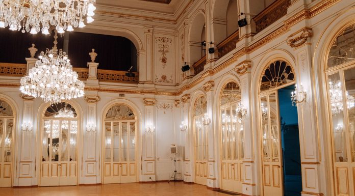 Elegant concert hall with chandeliers and ornate decor in Maribor, Slovenia.