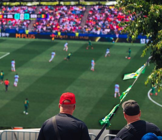 Engaging view of soccer fans enjoying a live match at a stadium in Langford, BC, Canada.