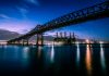 Stunning evening photograph of the Pulaski Skyway over water in New Jersey.