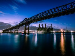 Stunning evening photograph of the Pulaski Skyway over water in New Jersey.