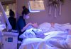 Ethos Aesthetics Hosts VIP Summer Event in Hoboken Patients receiving LED light therapy and facial treatment in a spa setting.