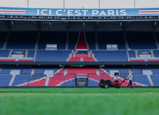 FIFA sells $450 World Cup Final grass from MetLife — grown by Rutgers Gardener working on the field at Parc des Princes stadium, Paris. Vibrant and iconic sports venue.