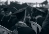 ‘Flunked Out’ of Rutgers, Now Off to Cornell: A Jersey City Success Story Black and white photo of graduates in caps and gowns at a ceremony.