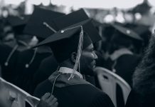 ‘Flunked Out’ of Rutgers, Now Off to Cornell: A Jersey City Success Story Black and white photo of graduates in caps and gowns at a ceremony.