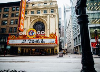 Vibrant view of the historic Chicago Theatre on a bustling downtown street.