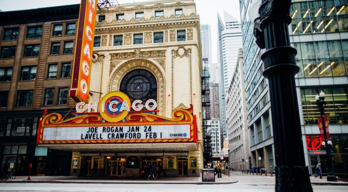 Vibrant view of the historic Chicago Theatre on a bustling downtown street.