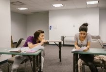 How to Get Your GED in North Bergen, NJ: A Complete 2026 Guide Two college students in a classroom setting, one appears to be copying from the other's paper.
