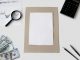 Jersey City Cultural Affairs Told to ‘Do More With Less’ as Budget Gap Looms Flat lay of financial tools and blank paper for planning or mockup.