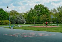 Jersey City Mom Scores World Cup Tickets and $20K After Random Act of Kindness A father and child enjoy playing basketball on an outdoor court in a green, tranquil park setting.