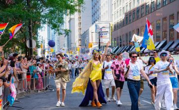 Colorful Pride Parade with diverse participants celebrating in Toronto's vibrant streets.