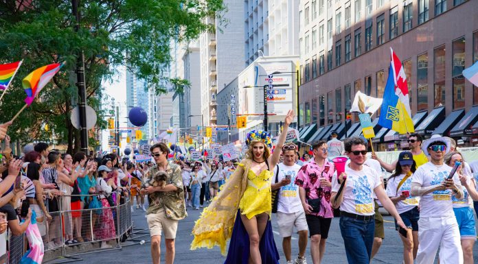 Colorful Pride Parade with diverse participants celebrating in Toronto's vibrant streets.