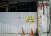 Jersey City’s Big Promises That Went Nowhere Abandoned building site with a warning sign and orange cones.