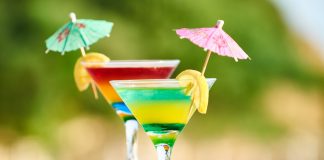Vibrant cocktails with lemon slices and umbrellas, perfect for summer celebrations.
