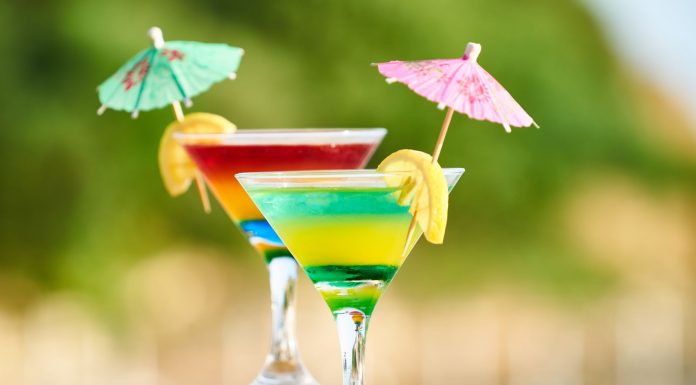 Vibrant cocktails with lemon slices and umbrellas, perfect for summer celebrations.