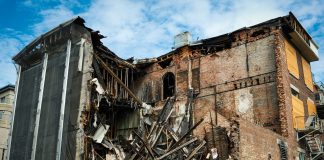 Scene of a partially demolished brick building in Montreal, showcasing urban decay and redevelopment.