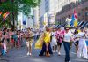 Colorful Pride Parade with diverse participants celebrating in Toronto's vibrant streets.