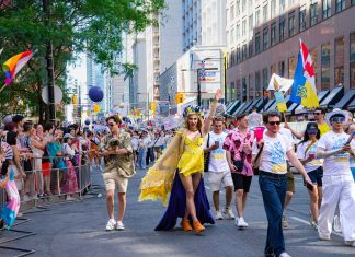 Colorful Pride Parade with diverse participants celebrating in Toronto's vibrant streets.