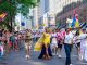 Colorful Pride Parade with diverse participants celebrating in Toronto's vibrant streets.