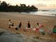 Women practicing yoga on Bondi Beach, Sydney, during a beautiful sunrise.