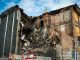 Scene of a partially demolished brick building in Montreal, showcasing urban decay and redevelopment.