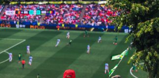 Engaging view of soccer fans enjoying a live match at a stadium in Langford, BC, Canada.