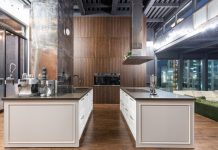 Luxury Duplex Approved Next to Massive Train Exhaust Vent in Jersey City Interior of contemporary spacious kitchen with stylish furniture in apartment with loft style