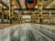 Mars Wrigley Leaving Newark, 307 Jobs Lost by October Wide view of an empty industrial warehouse with visible cranes and metal structures.