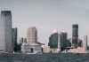 Mudarse a Union City: Todo Lo Que Necesitas Saber en 2026 A breathtaking view of Jersey City's skyline from across the Hudson River with modern skyscrapers and waterfront buildings.