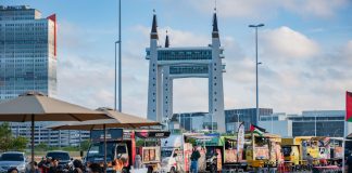 View of lively food truck area near the iconic Terengganu Drawbridge. Perfect for street food enthusiasts.