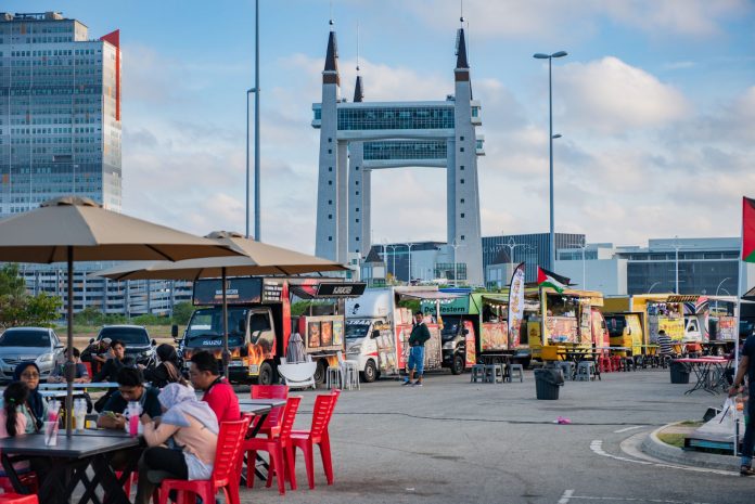 north-bergen-s-summer-on-the-river-returns-wednesd View of lively food truck area near the iconic Terengganu Drawbridge. Perfect for street food enthusiasts.