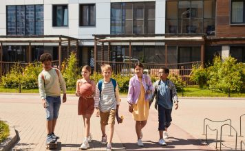 A diverse group of children walking outdoors, symbolizing friendship and multicultural unity.
