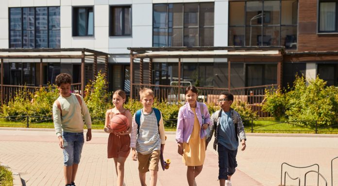 A diverse group of children walking outdoors, symbolizing friendship and multicultural unity.