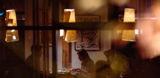 Top 10 Restaurants in Newark Right Now: The Best Places to Eat in 2026 Romantic dining scene in a cozy restaurant with warm lighting and intimate atmosphere.