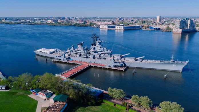 Stunning aerial shot of the USS New Jersey battleship docked in Philadelphia, Pennsylvania.