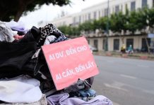 Where to Donate Clothes in Jersey City: A Practical Guide Clothes donation on city street with sign offering free items to those in need.
