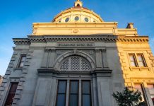 Detailed view of the historic Williamsburgh Savings Bank in Brooklyn, New York, captured at sunset.