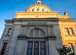 Detailed view of the historic Williamsburgh Savings Bank in Brooklyn, New York, captured at sunset.