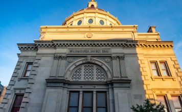 Detailed view of the historic Williamsburgh Savings Bank in Brooklyn, New York, captured at sunset.