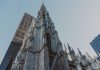 St. Patrick's Cathedral and nearby skyscrapers, showcasing Gothic architecture in New York City.