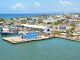 The 7 Best Dominican Restaurants in Hoboken for 2026: A Local’s Guide to Authentic Flavors Aerial view of Puerto Plata harbor with blue buildings, ships, and a coastal town in the Dominican Republic.