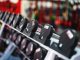 Close-up view of dumbbells in a modern gym setting, emphasizing fitness and training.