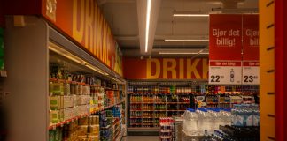 Best Supermarkets in Elizabeth: Your 2026 Local Shopping Guide Colorful drink aisle in a supermarket with signage promoting deals.