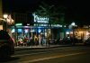 Best Things To Do in Elizabeth at Night in 2026: A Local’s Guide A bustling urban nightlife scene at a restaurant and oyster bar, with people dining outside.