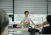 Chef leading a cooking class, explaining techniques to students in a bright, modern kitchen.