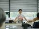Chef leading a cooking class, explaining techniques to students in a bright, modern kitchen.