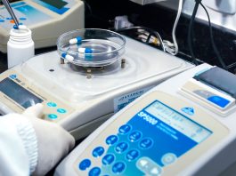 BREAKING: $300K Pharma Job Leads 8 New Jersey Openings Close-up of laboratory equipment with capsules, capturing pharmaceutical analysis.