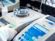Close-up of laboratory equipment with capsules, capturing pharmaceutical analysis.